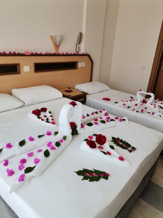 Dreibettzimmer mit Gartenblick